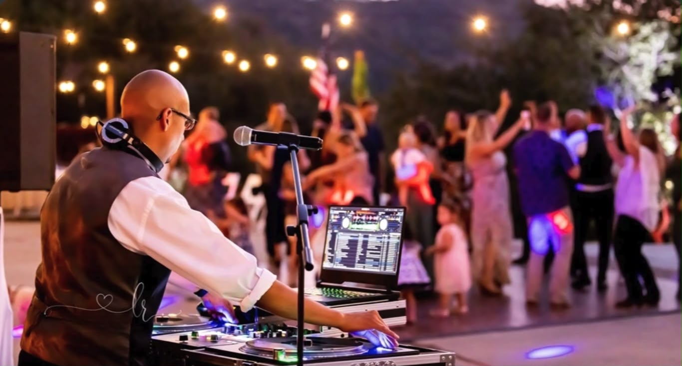 Guests celebrating at an AVM after-party with a live DJ